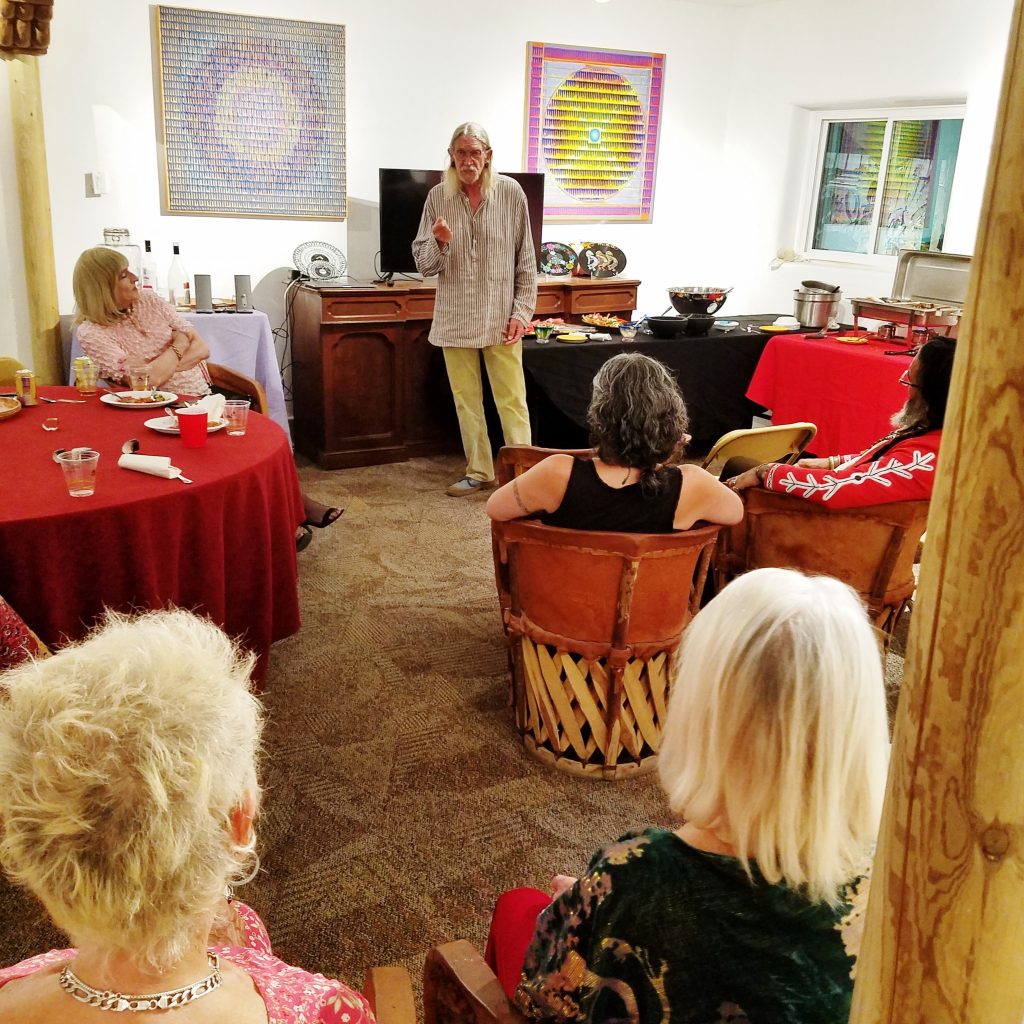 A group of people sitting around in a room.