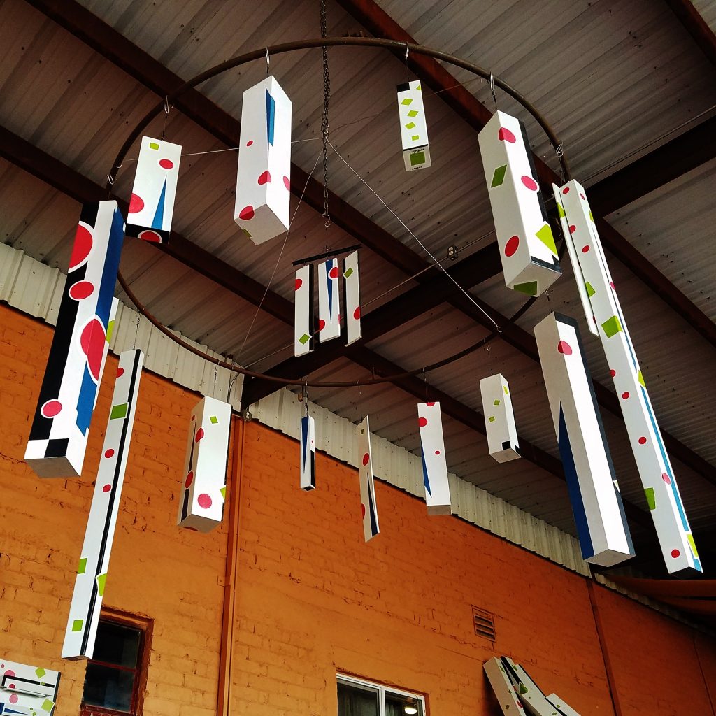 A large metal sculpture hanging from the ceiling.